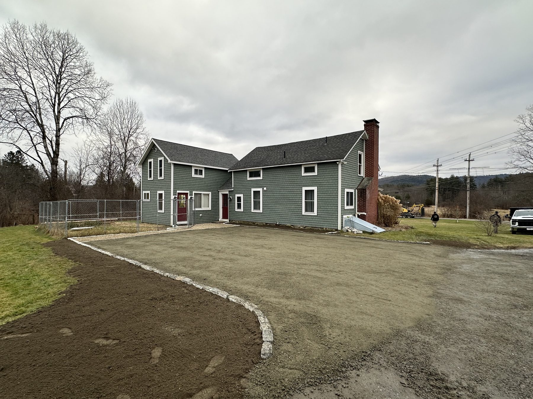 Gravel driveway shaped with granite curbing