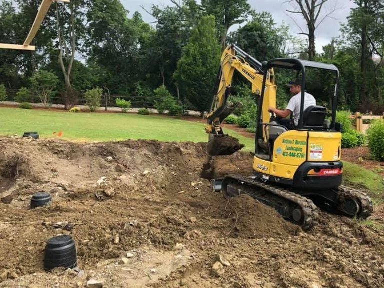 Nathan T Buratto Landscaping excavator working a residential site