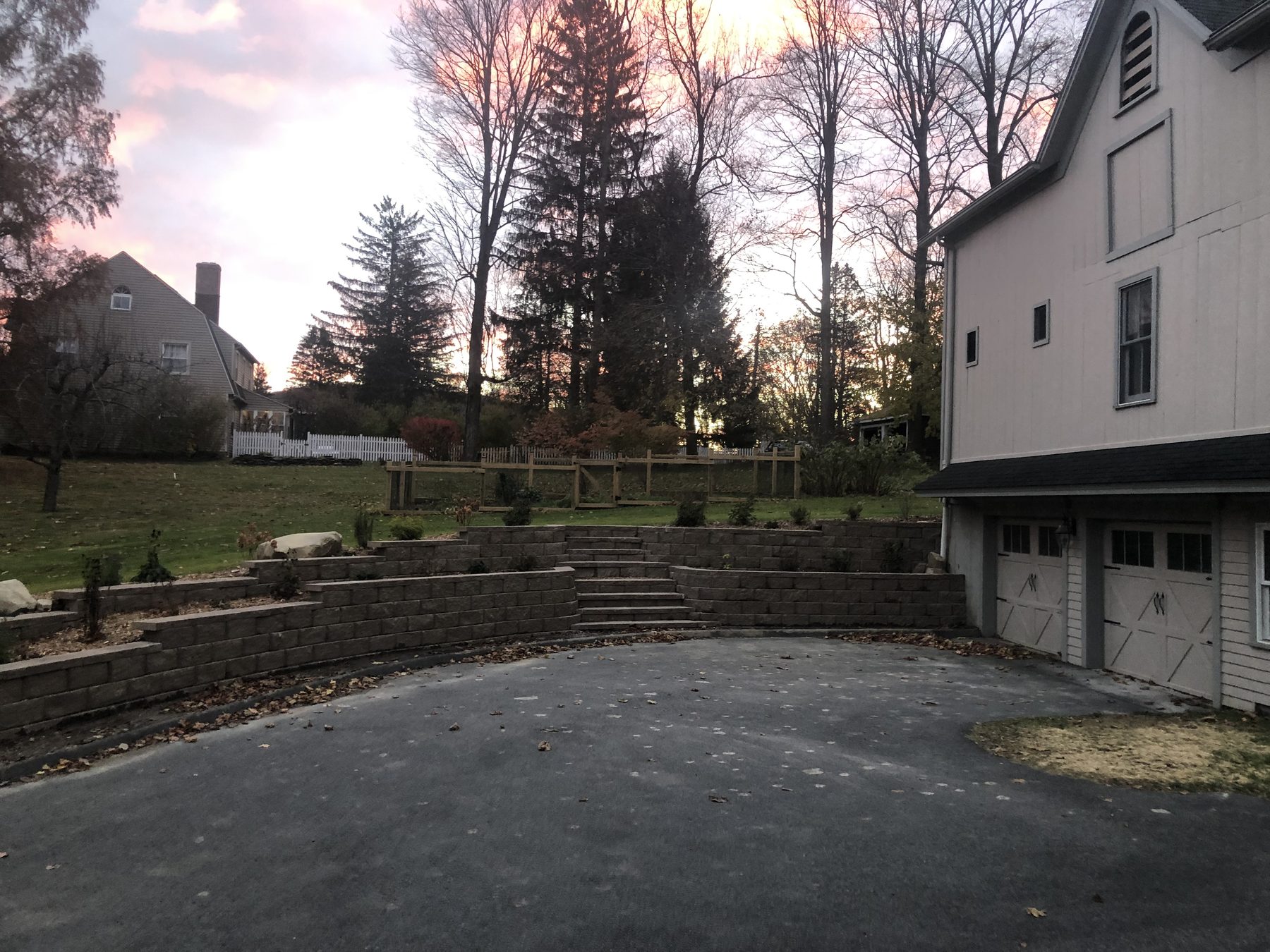 Retaining wall and steps alongside a driveway