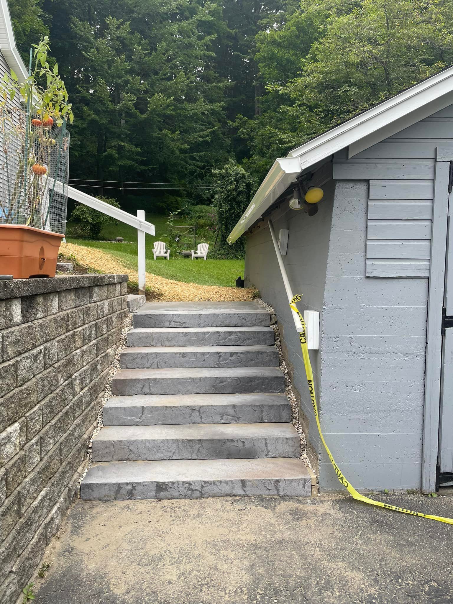Block retaining wall with stone steps