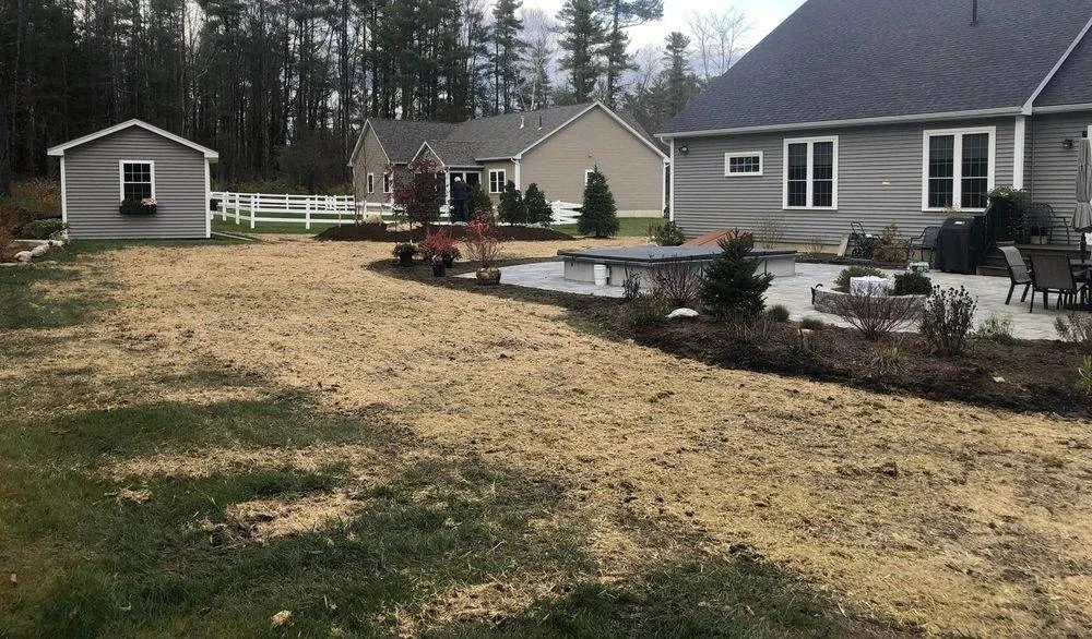 New patio with freshly seeded lawn around it