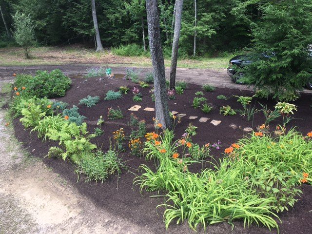 Perennial bed with stepping stones installed by Nathan T Buratto Landscaping