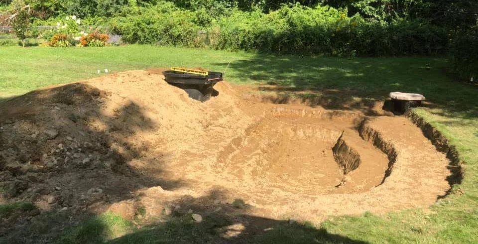 Pond shape excavated into a lawn