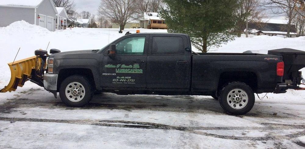 Nathan T Buratto Landscaping plow truck during a winter storm
