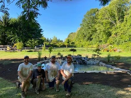 The Nathan T Buratto Landscaping crew at a completed pond project